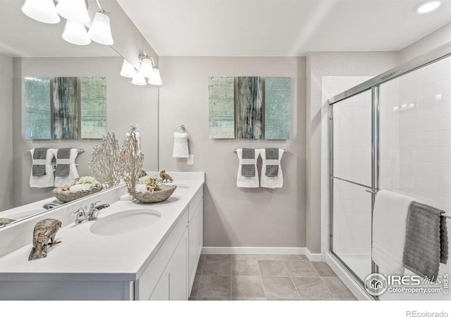 bathroom with vanity and an enclosed shower