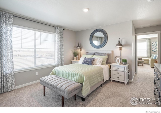 bedroom with light colored carpet