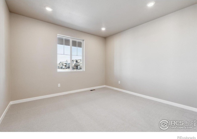 unfurnished room with carpet