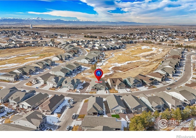 drone / aerial view featuring a mountain view