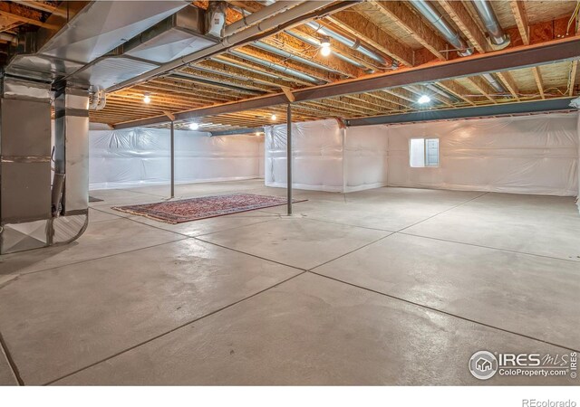 basement featuring heating unit