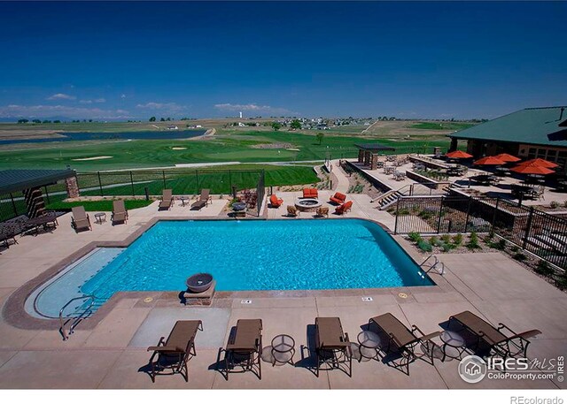 view of swimming pool with a patio area