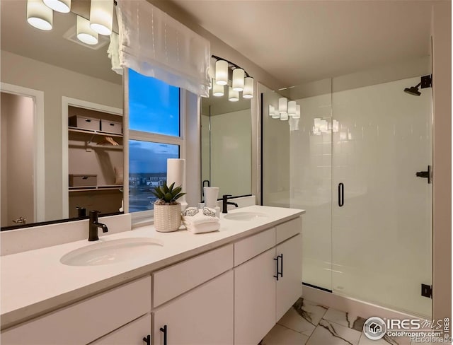 bathroom with an enclosed shower and vanity