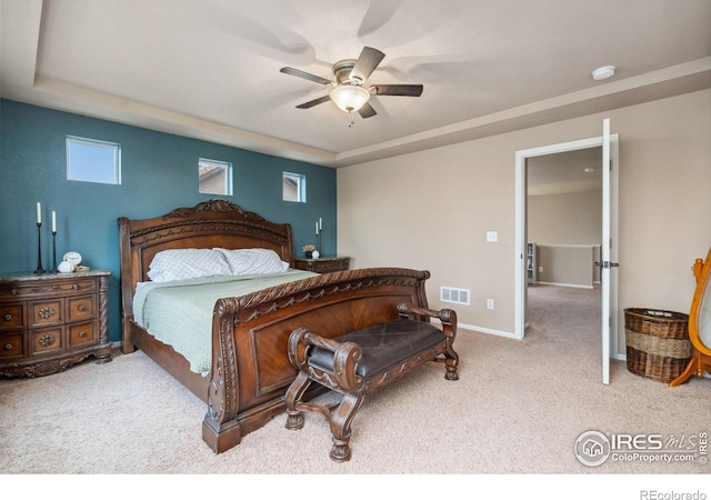 bedroom with ceiling fan and light carpet