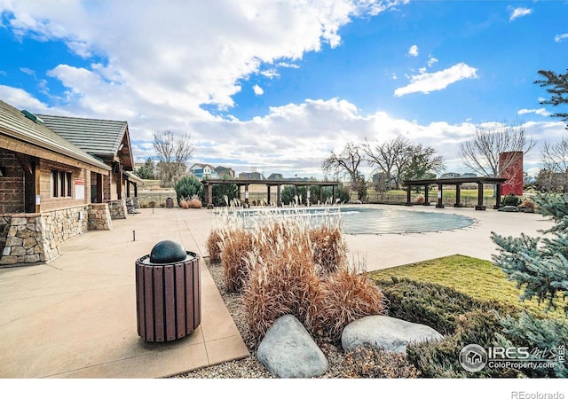 view of swimming pool featuring a gazebo and a patio