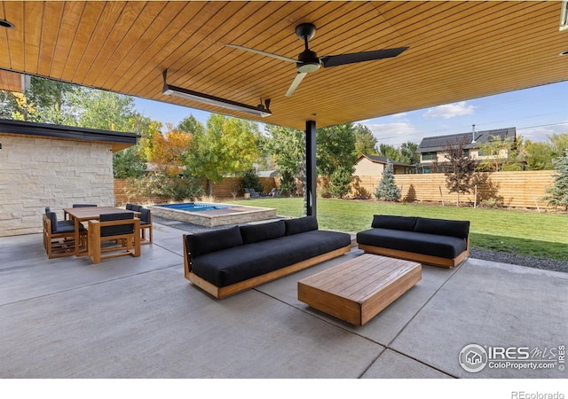 view of patio / terrace with an outdoor hangout area, ceiling fan, and a jacuzzi