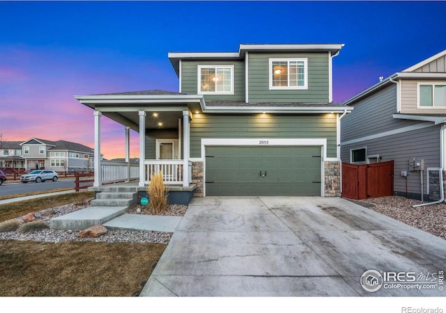 view of front of home featuring a garage and covered porch