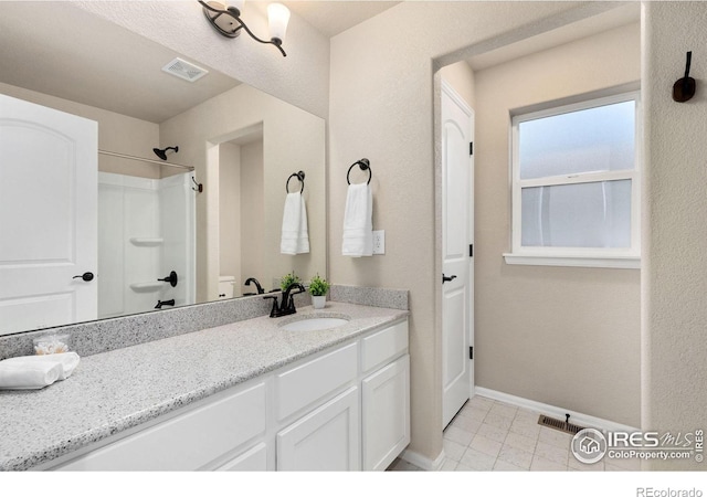 bathroom featuring vanity and walk in shower