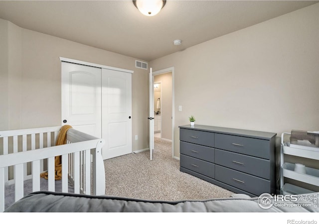 carpeted bedroom featuring a closet