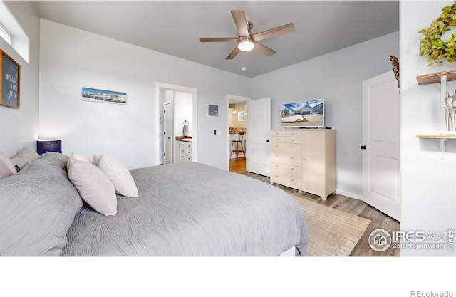 bedroom with ceiling fan and dark hardwood / wood-style flooring