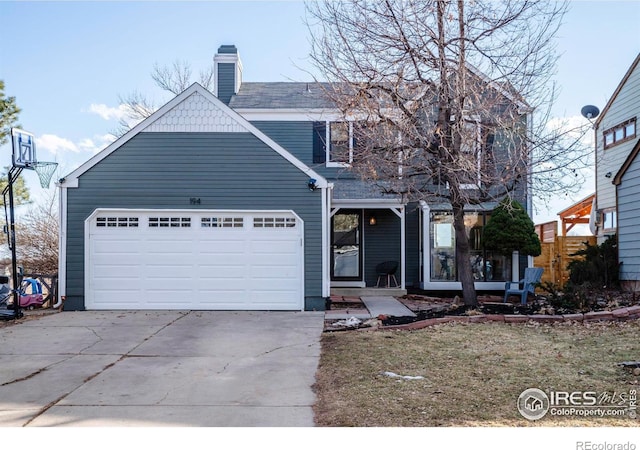 view of property with a garage and a front yard