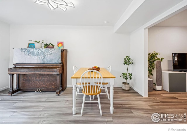 dining area with hardwood / wood-style flooring