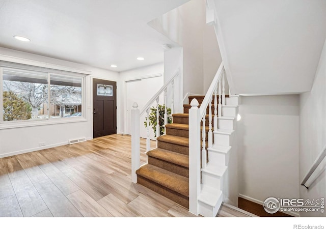 foyer with light hardwood / wood-style floors