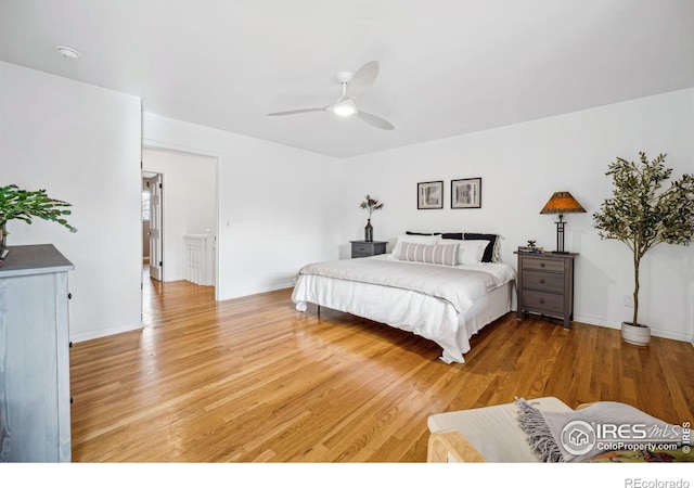 bedroom featuring hardwood / wood-style flooring and ceiling fan