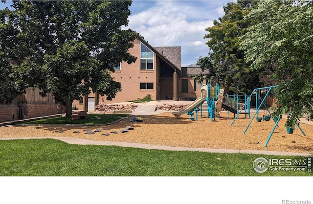 view of play area featuring a lawn