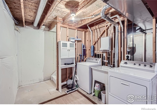 washroom featuring independent washer and dryer