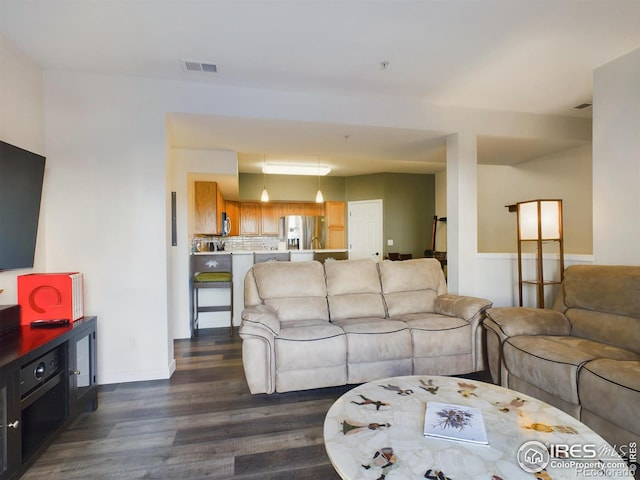 living room with dark hardwood / wood-style floors