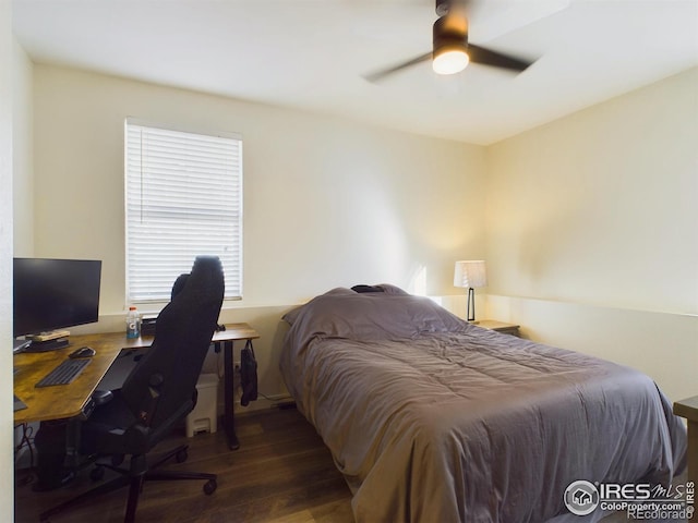 bedroom featuring dark wood-type flooring and ceiling fan