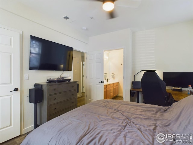 bedroom featuring wood-type flooring, ensuite bathroom, and ceiling fan