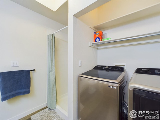 laundry room with washing machine and dryer