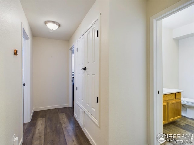 corridor featuring dark hardwood / wood-style flooring