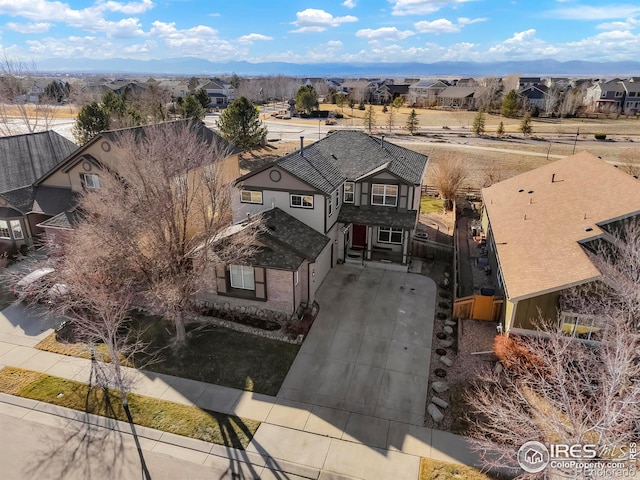 birds eye view of property with a residential view and a mountain view