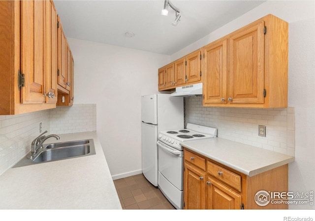 kitchen with white electric range, sink, and decorative backsplash