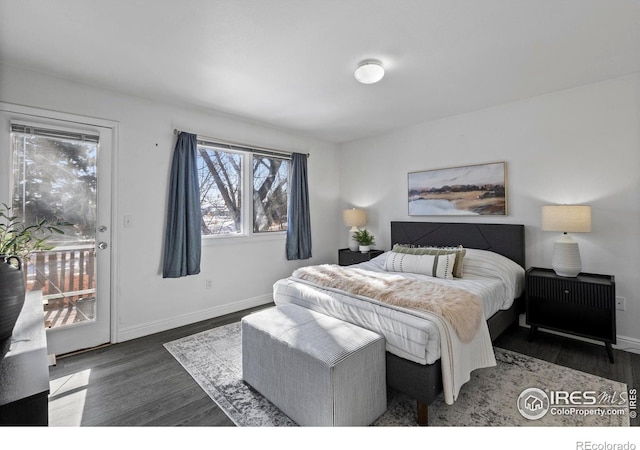 bedroom with dark wood-type flooring and access to exterior