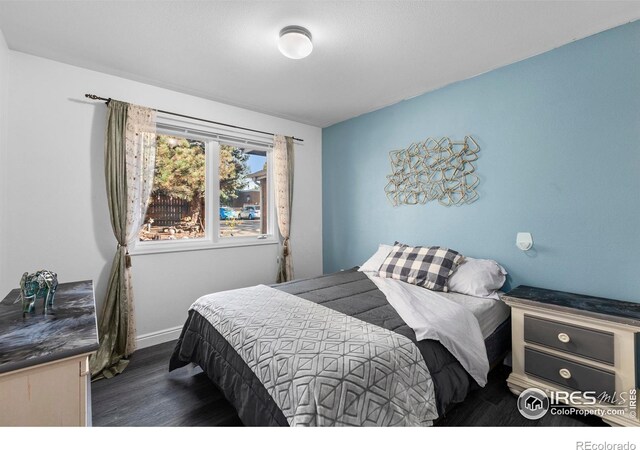 bedroom featuring dark hardwood / wood-style floors