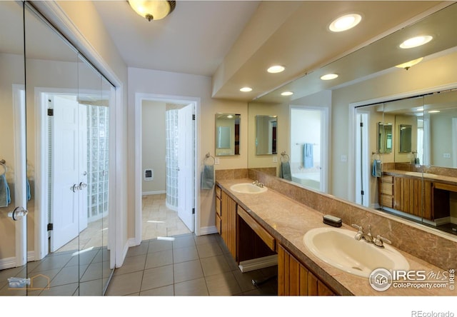 bathroom with vanity and tile patterned floors