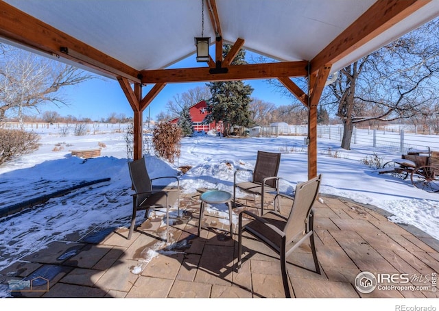 view of snow covered patio