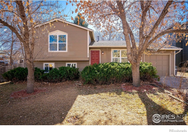 split level home with a garage