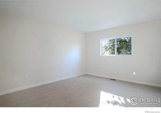 view of carpeted spare room