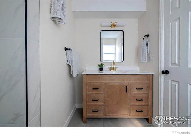 bathroom featuring vanity and tile patterned flooring