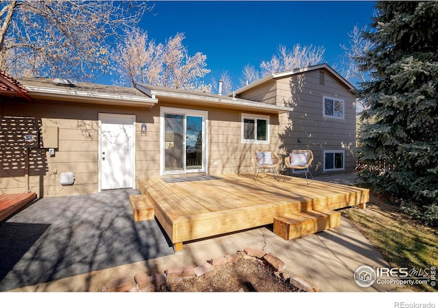 rear view of house with a deck