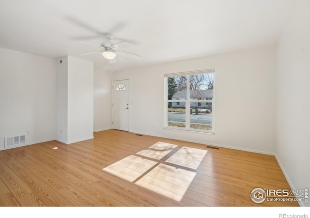 unfurnished room featuring ceiling fan and light hardwood / wood-style floors