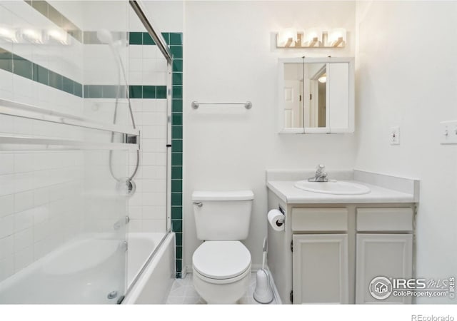 full bathroom with toilet, vanity, shower / bath combination with glass door, and tile patterned flooring