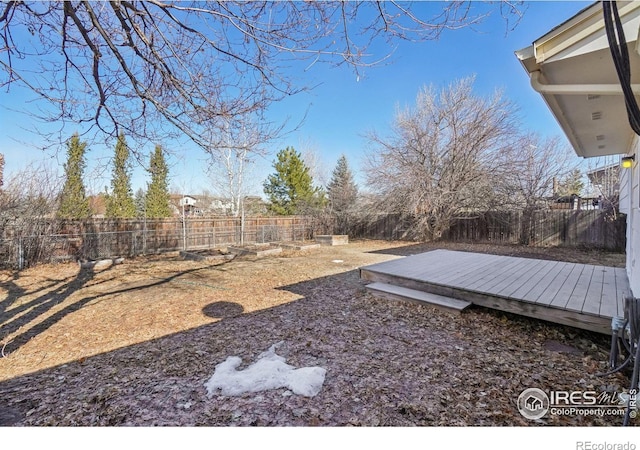 view of yard with a wooden deck