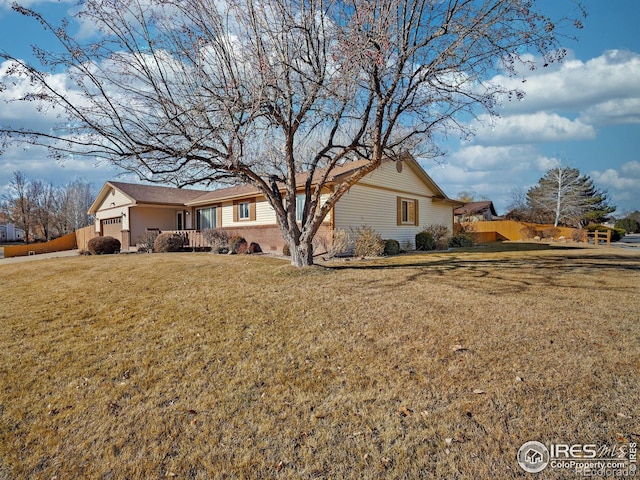 exterior space with a garage and a yard