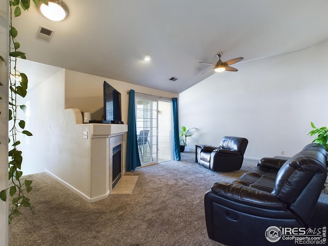 carpeted living room featuring lofted ceiling and ceiling fan