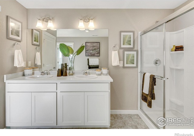 bathroom with walk in shower and vanity