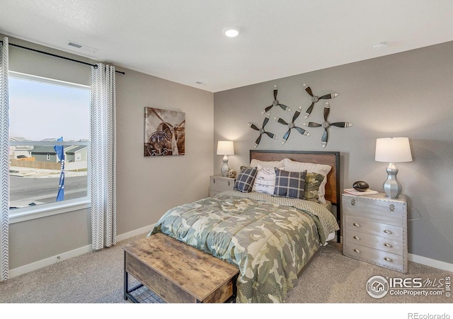 bedroom with light colored carpet