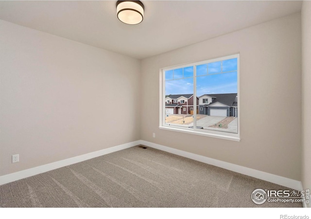 7172 Feather Reed Dr, Wellington, CO 80549 - carpeted spare room featuring baseboards and visible vents