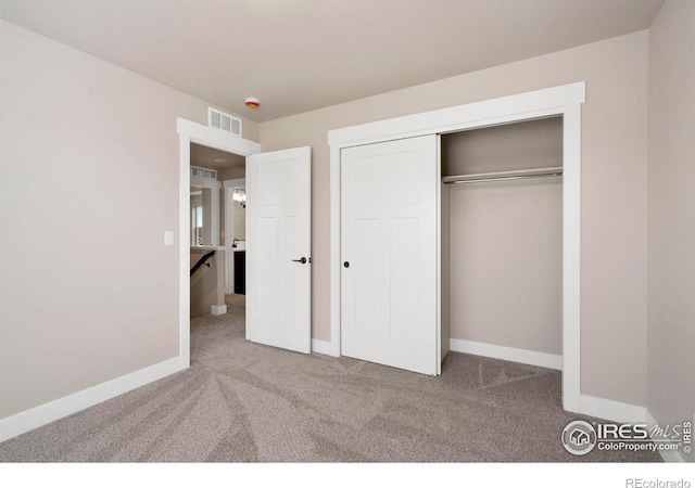 7172 Feather Reed Dr, Wellington, CO 80549 - unfurnished bedroom with baseboards, visible vents, a closet, and carpet