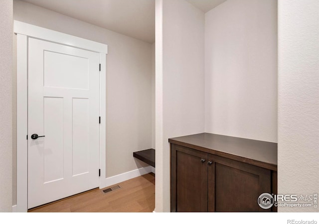 7172 Feather Reed Dr, Wellington, CO 80549 - mudroom with baseboards, visible vents, and light wood-style flooring