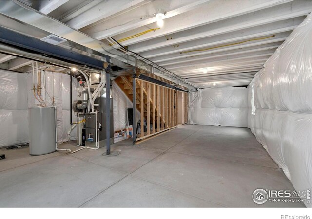 7172 Feather Reed Dr, Wellington, CO 80549 - unfinished below grade area with visible vents, heating unit, and gas water heater