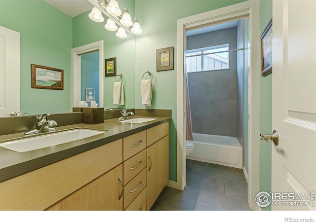 full bathroom featuring shower / bath combination with curtain, tile patterned floors, toilet, and vanity