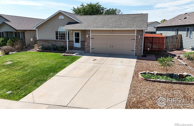 ranch-style home featuring a garage and a front yard