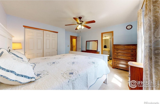 carpeted bedroom with ceiling fan, ensuite bathroom, and a closet