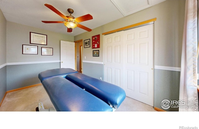 interior space featuring light carpet and ceiling fan